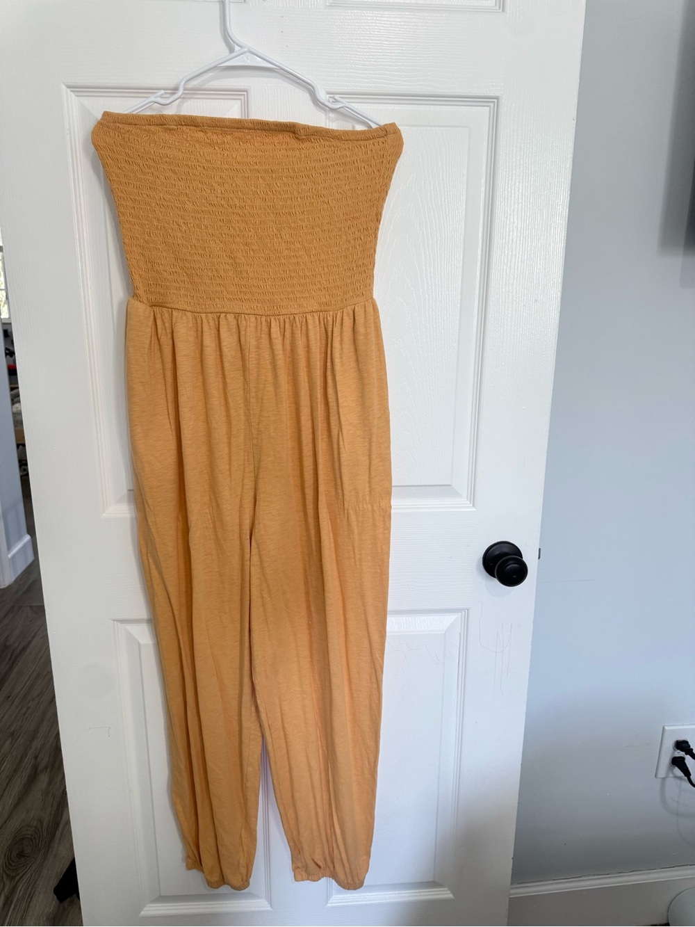 American Eagle Outfitters Strapless Smocked Jumpsuit in orange